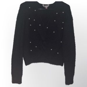 Black knit sweater with pearl details & a twist in the front